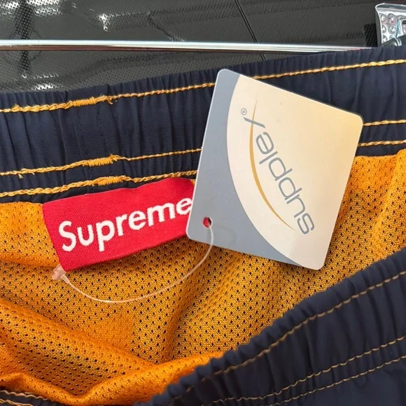 Supreme Big Letter Water Board Shorts with Bold Graphic Design